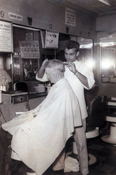 Old shot of Sal cutting hair.